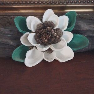 My coastal art a magnolia on driftwood white and green.
